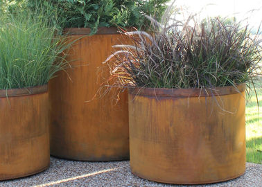 Un buen precio. Cajas de acero redondas oxidadas de los plantadores de Corten del paisaje para la prenda impermeable de la plaza en línea